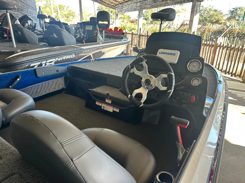 Slide: The Image of 2025 Nitro Z17 boat interior with steering wheel and Lowrance dashboard. - 4