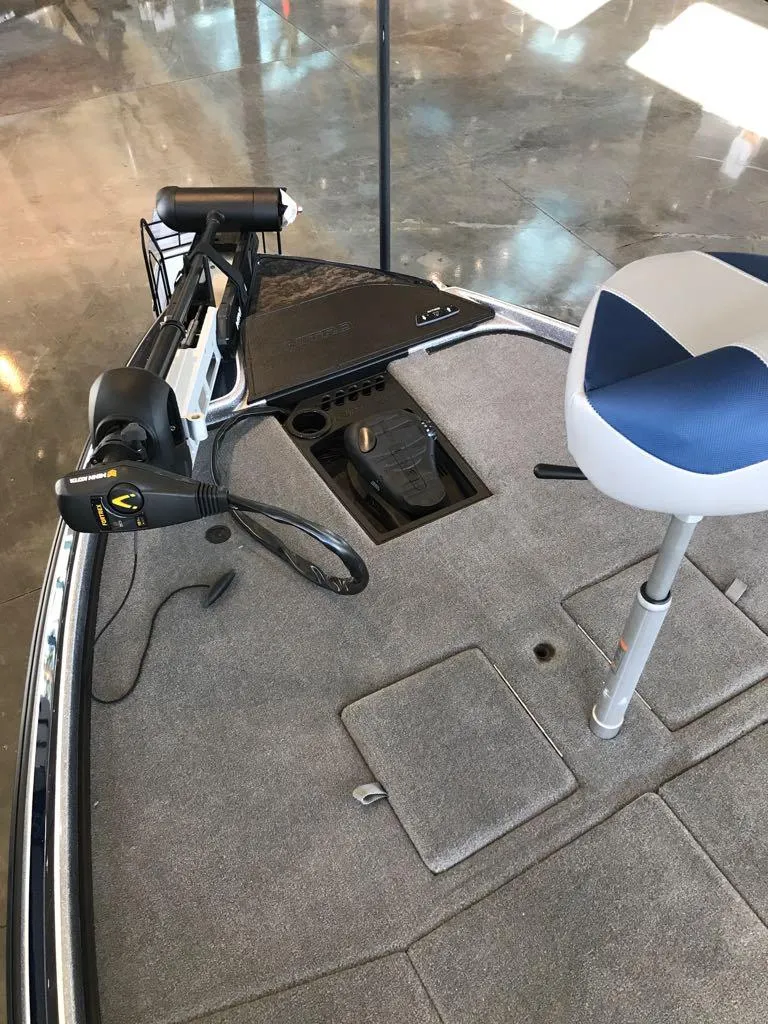 Slide: The Image of 2025 Nitro Z21 XL boat deck with trolling motor and swivel seat. - 10