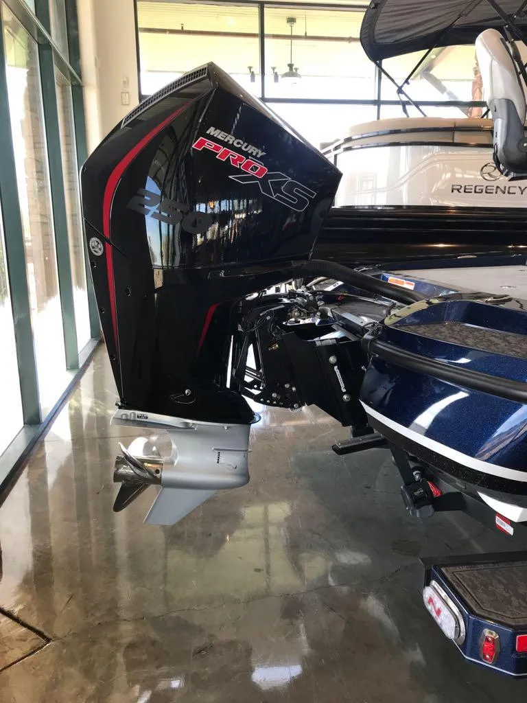 Slide: The Image of 2025 Nitro Z21 XL boat with Mercury Pro XS engine, displayed indoors. - 3