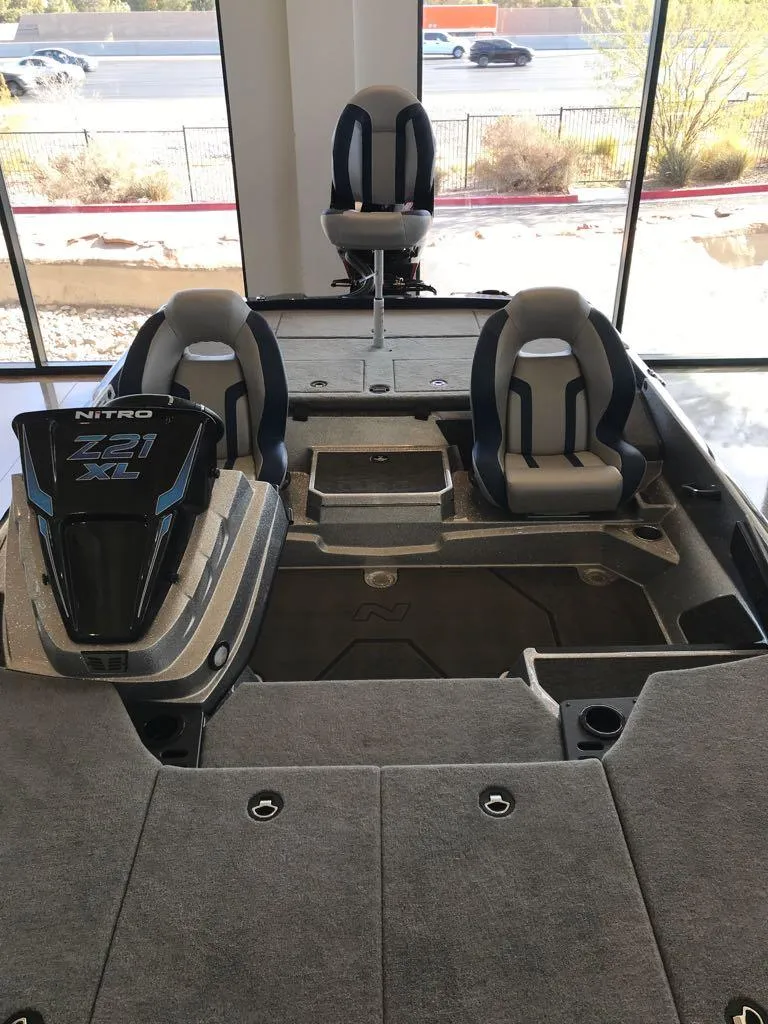 Slide: The Image of 2025 Nitro Z21 XL boat interior with seating and storage compartments. - 7