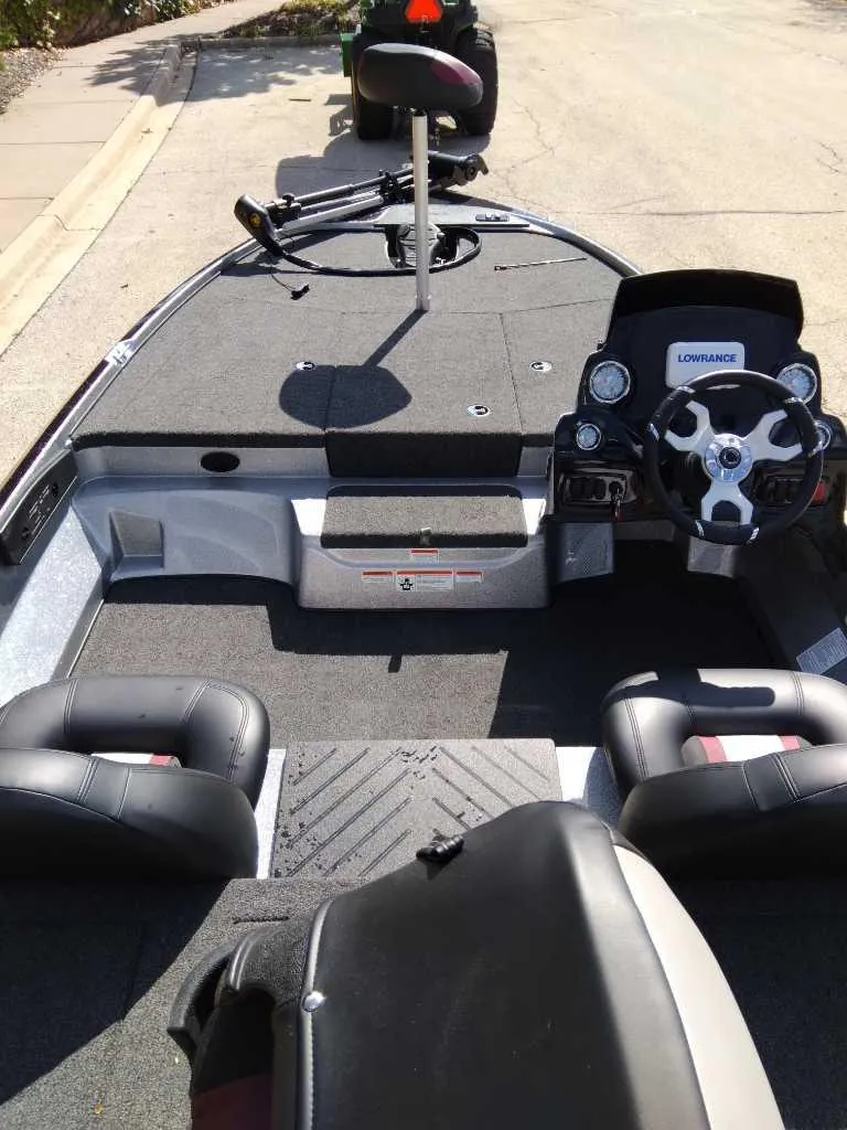 Slide: The Image of 2025 Nitro Z17 boat interior with steering wheel and seating. - 2