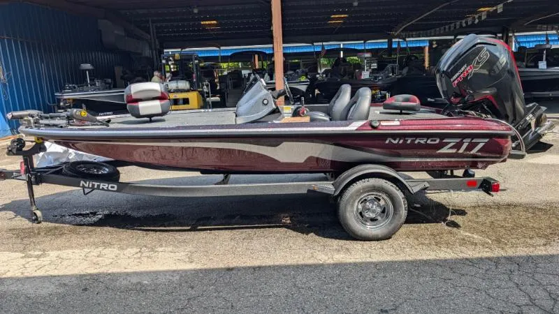 The Image of 2025 Nitro Z17 boat on trailer in a covered storage area. - 0