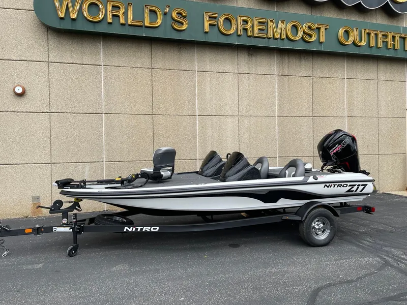 The Image of 2025 Nitro Z17 fishing boat on trailer outside outfitter store. - 0