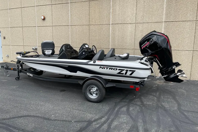 Slide: The Image of 2025 Nitro Z17 boat with Mercury Pro XS engine, parked on pavement. - 65