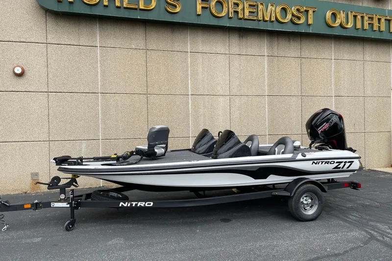 Slide: The Image of 2025 Nitro Z17 boat on trailer, parked outside a building. - 66