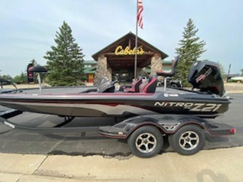 The Image of 2025 Nitro Z21 XL boat parked outside Cabela's store. - 0