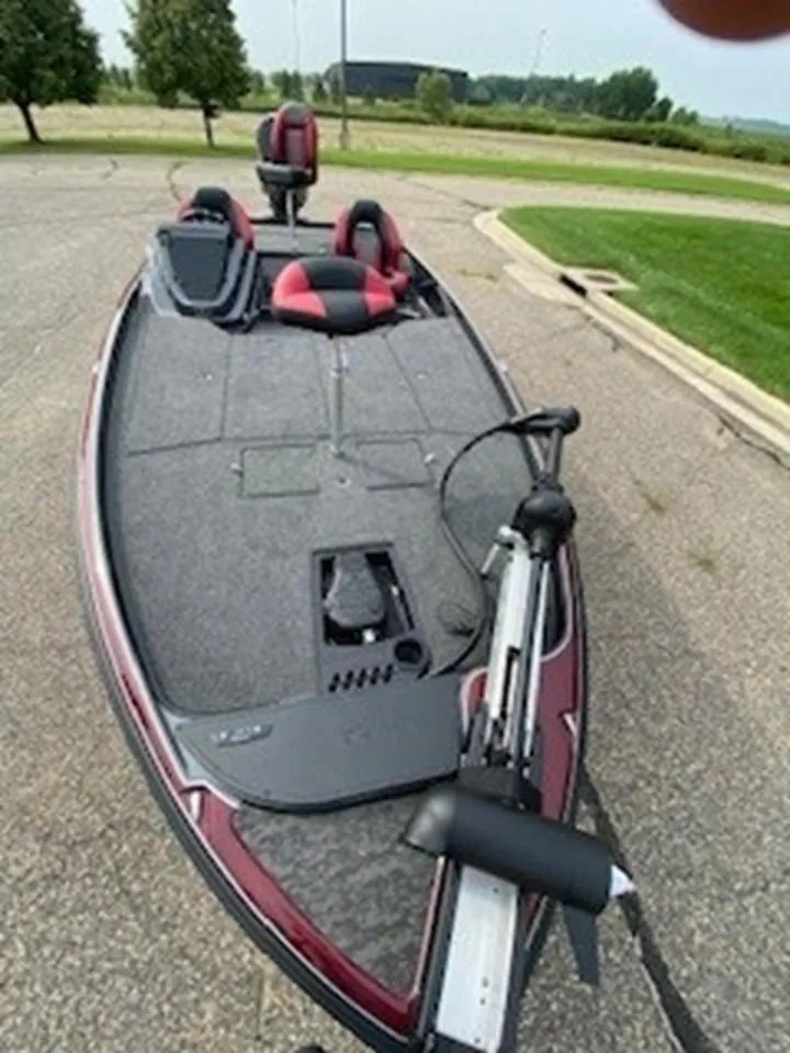 Slide: The Image of 2025 Nitro Z21 XL bass boat with dual seats and trolling motor. - 11