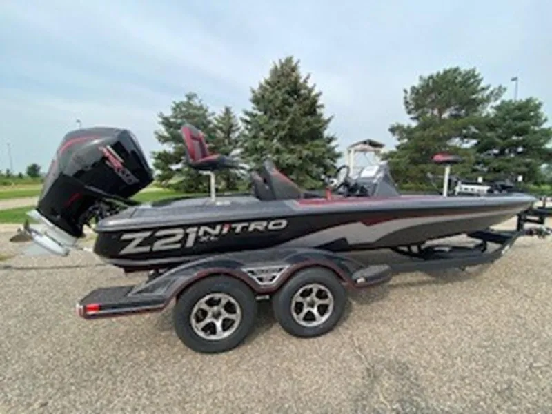 Slide: The Image of 2025 Nitro Z21 XL boat on trailer, parked outdoors. - 13