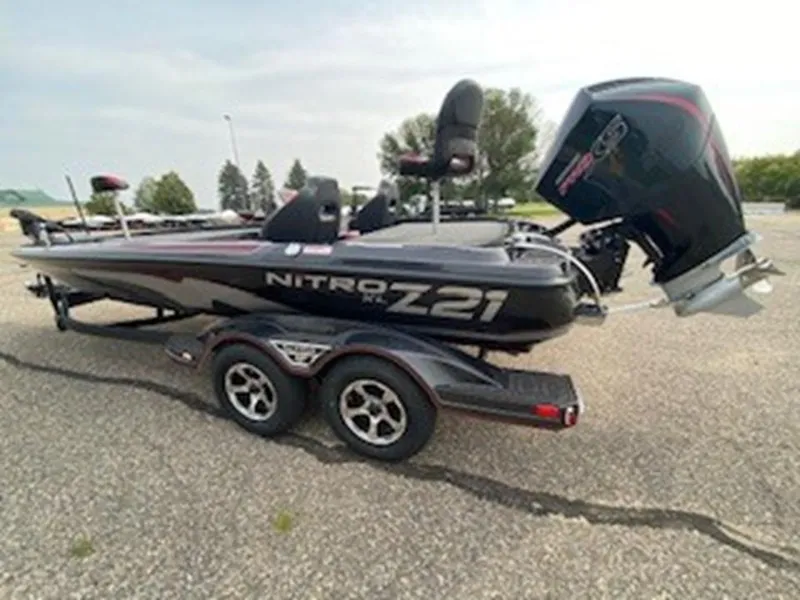 Slide: The Image of 2025 Nitro Z21 XL boat on trailer, parked outdoors. - 3