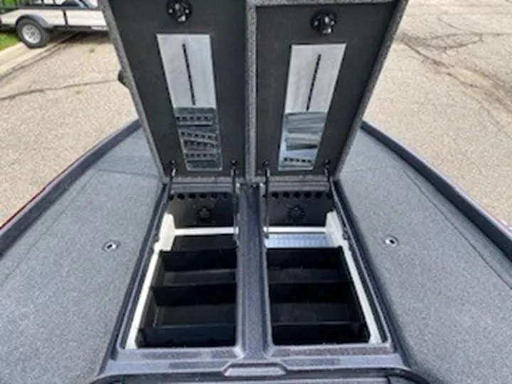 Slide: The Image of 2025 Nitro Z21 XL boat storage compartments open, showcasing organized interior. - 6