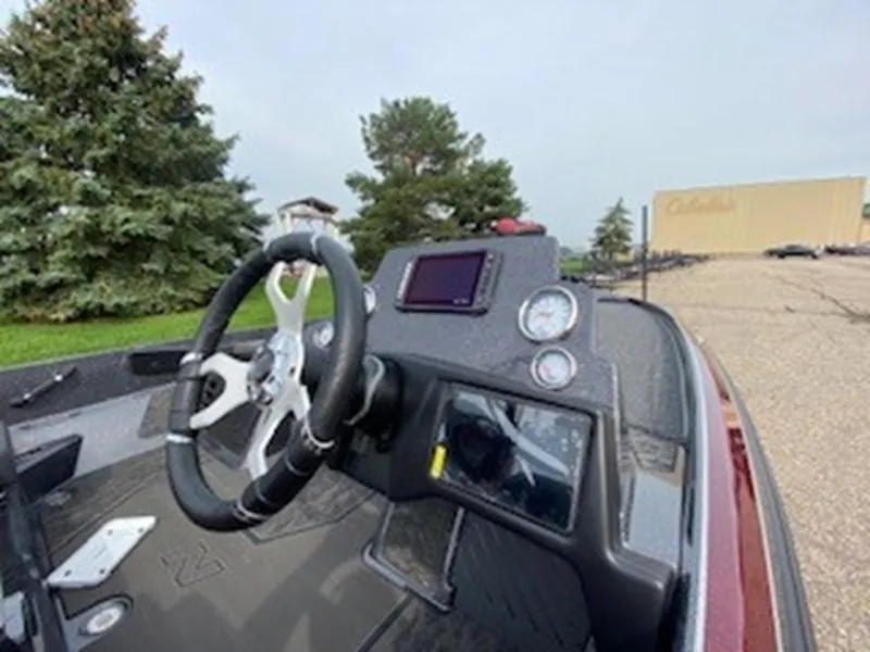 Slide: The Image of 2025 Nitro Z21 XL boat dashboard with steering wheel and gauges. - 7