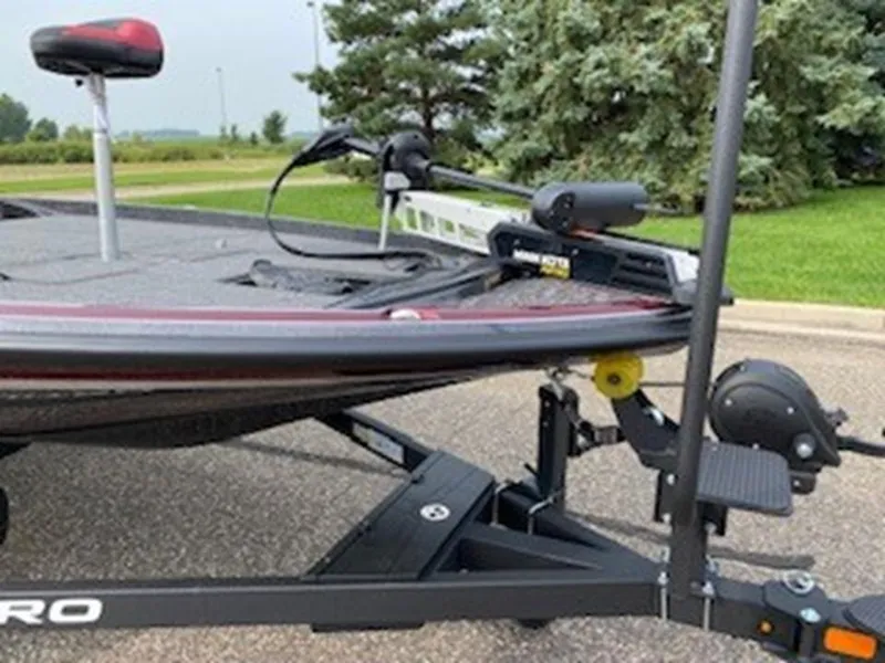 Slide: The Image of 2025 Nitro Z21 XL boat on trailer, parked outdoors. - 9
