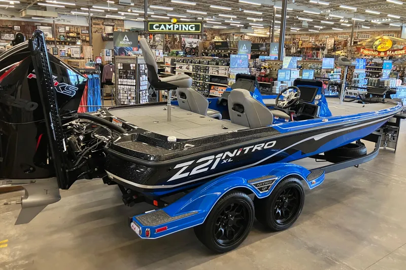 Slide: The Image of 2025 Nitro Z21 XL Pro boat displayed in a store, featuring sleek design and modern features. - 1