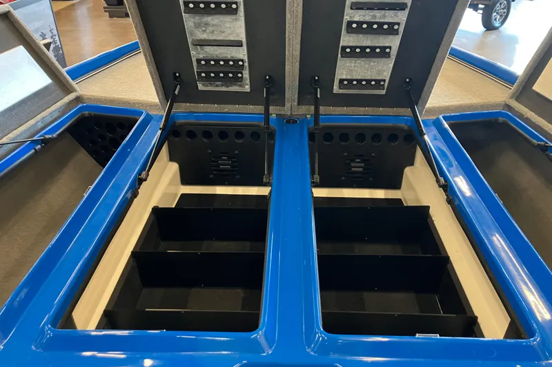 Slide: The Image of 2025 Nitro Z21 XL Pro boat storage compartments with open lids, showcasing organized interior space. - 9