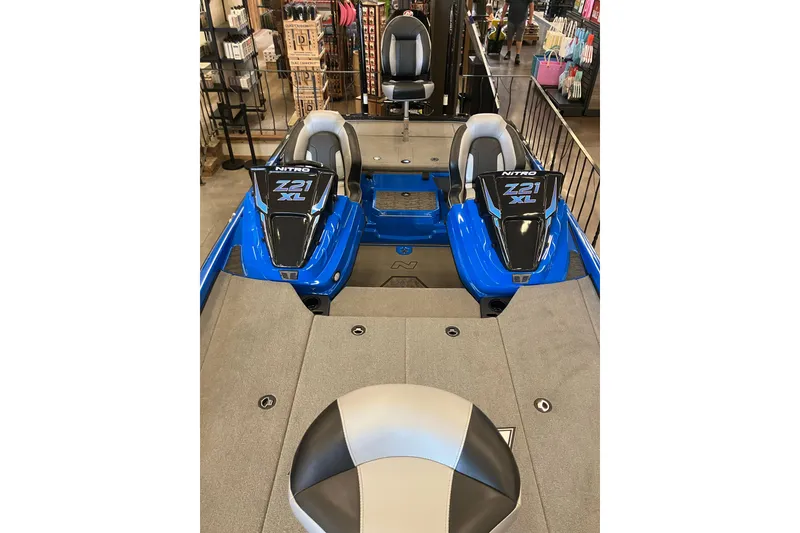 Slide: The Image of 2025 Nitro Z21 XL Pro boat interior with dual seats and sleek design. - 11