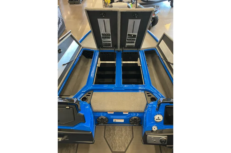 Slide: The Image of 2025 Nitro Z21 XL Pro boat interior with open storage compartments and blue accents. - 8
