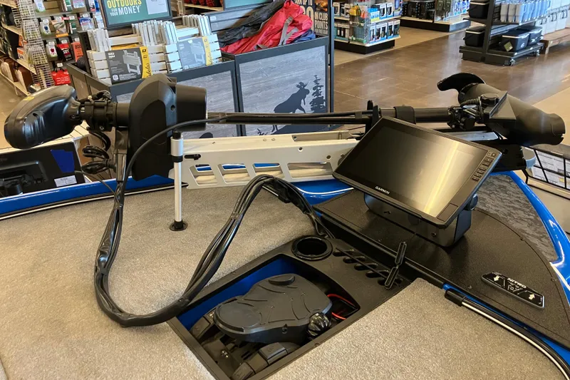 Slide: The Image of 2025 Nitro Z21 XL Pro boat with advanced navigation system and trolling motor in a store display. - 2