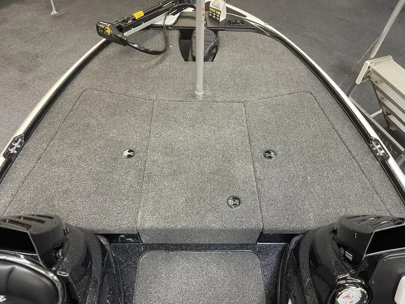 Slide: The Image of 2025 Nitro Z17 boat deck with gray carpet and storage compartments. - 11