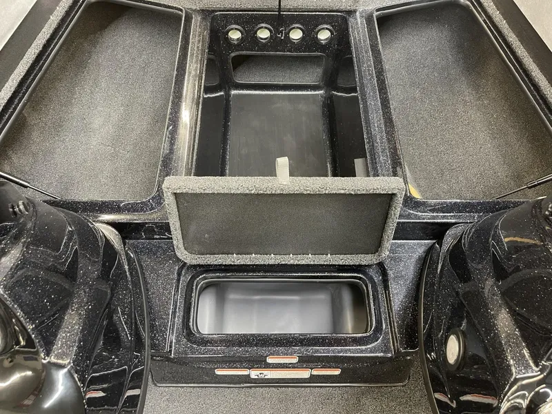 Slide: The Image of 2025 Nitro Z17 boat storage compartments and control panel. - 13