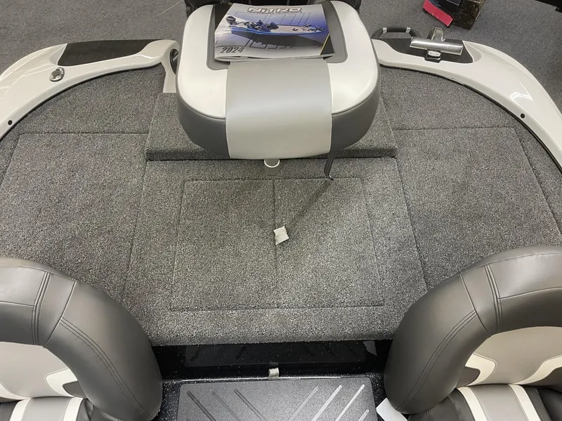Slide: The Image of 2025 Nitro Z17 boat interior with gray seating and carpeted deck. - 14