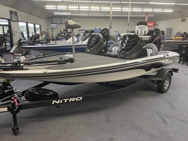 Slide: The Image of 2025 Nitro Z17 fishing boat in showroom, sleek design, black and white color scheme. - 3
