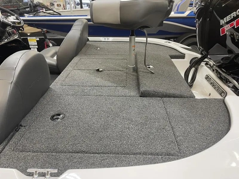 Slide: The Image of 2025 Nitro Z17 boat interior with gray seating and carpeted deck. - 5
