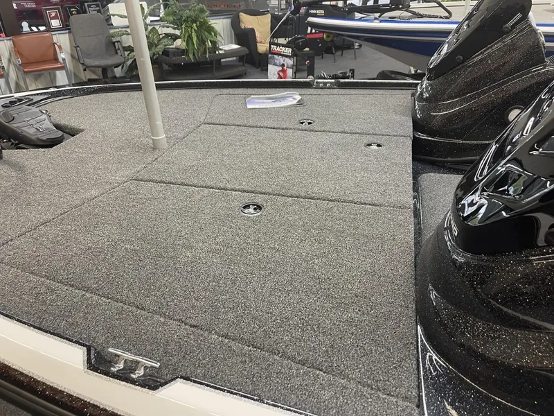 Slide: The Image of 2025 Nitro Z17 boat deck with carpeted surface and sleek black accents. - 8