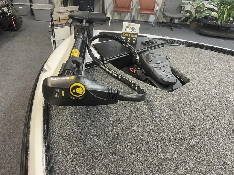 Slide: The Image of 2025 Nitro Z17 boat deck with trolling motor in showroom. - 9