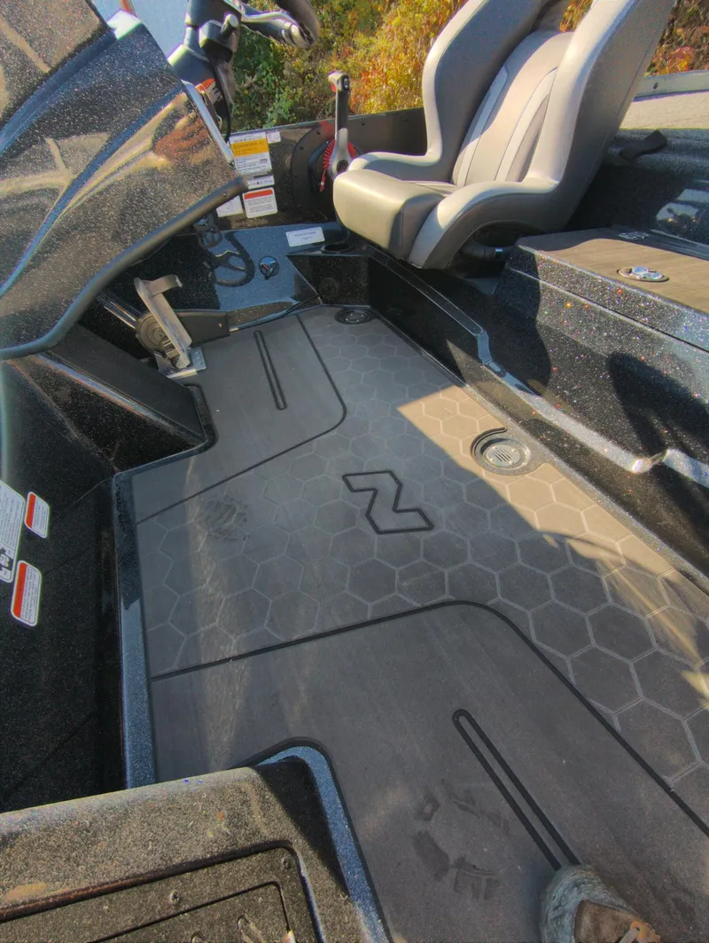 Slide: The Image of 2025 Nitro Z19 Pro boat interior with hexagonal floor design and dual seating. - 13