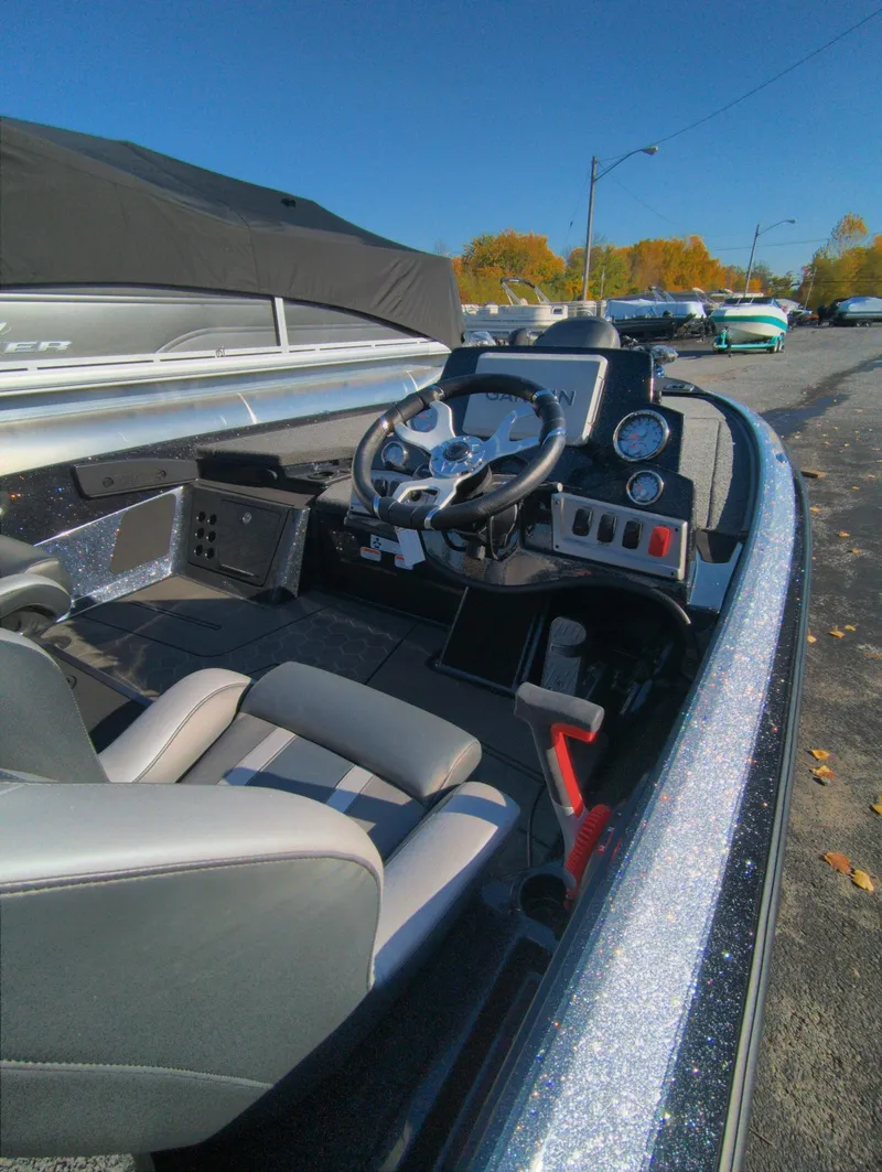 Slide: The Image of 2025 Nitro Z19 Pro boat interior with steering wheel and dashboard controls. - 7