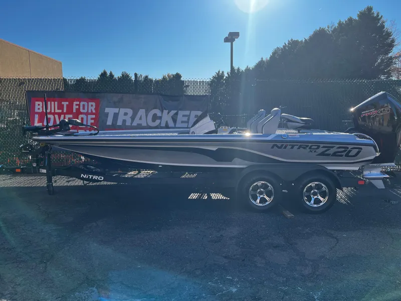 Slide: The Image of 2025 Nitro Z20 XL boat on trailer, outdoor display with Tracker signage. - 0