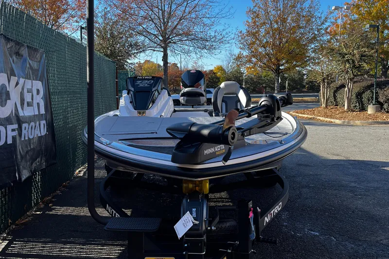Slide: The Image of 2025 Nitro Z20 XL boat parked outdoors in autumn setting. - 3