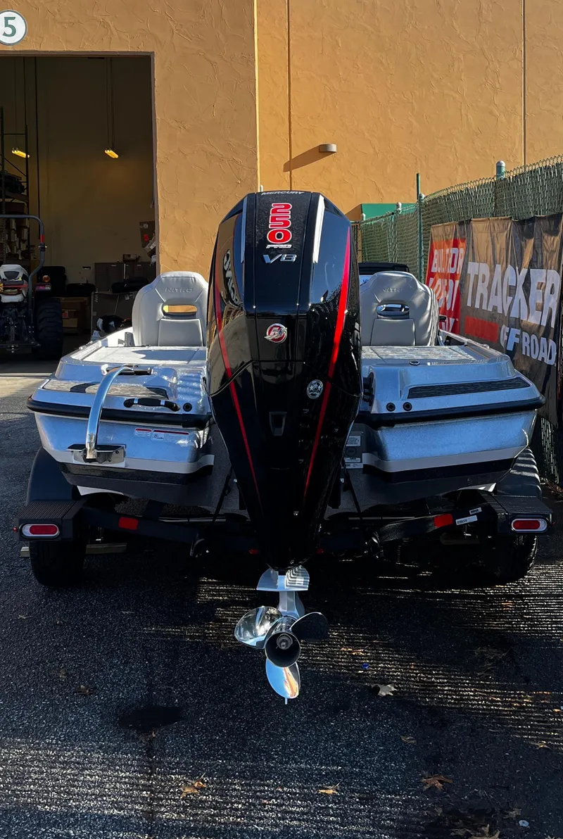 Slide: The Image of 2025 Nitro Z20 XL boat with powerful outboard motor, parked outdoors. - 4