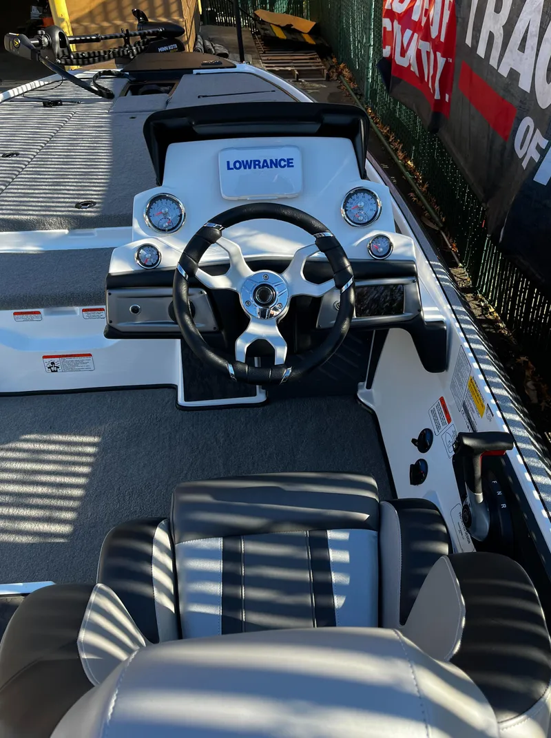 Slide: The Image of 2025 Nitro Z20 XL boat interior with steering wheel and dashboard controls. - 6