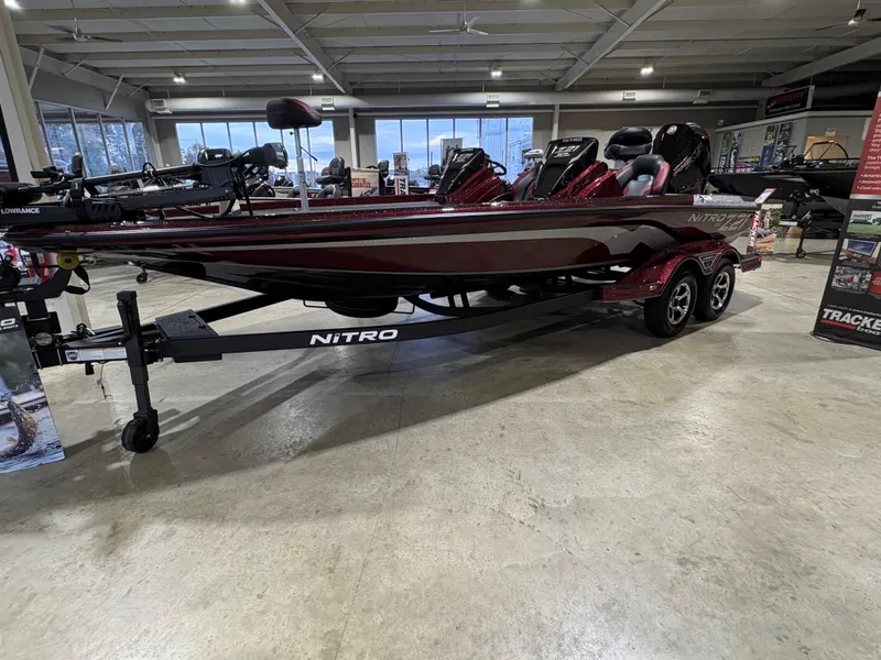 The Image of 2025 Nitro Z21 XL boat in showroom, sleek design, dual seats, trailer included. - 0