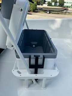 Slide: The Image of 2025 Mako Pro Skiff 17 CC boat seat with storage compartment open. - 47