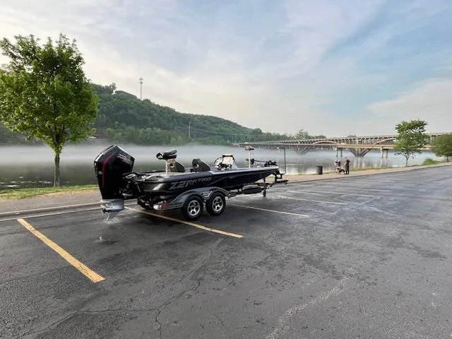 Slide: The Image of 2025 Nitro Z21 XL boat on trailer in scenic outdoor setting. - 3