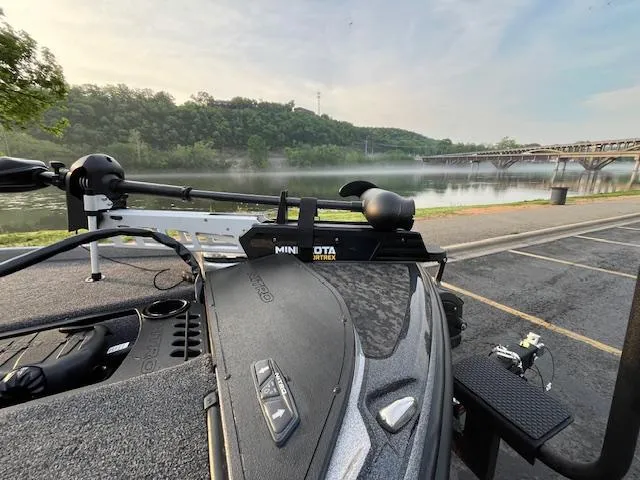 Slide: The Image of 2025 Nitro Z21 XL boat parked on wet pavement, front view. - 9
