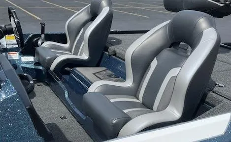 Slide: The Image of 2025 Nitro Z20 XL boat seats, gray and white design, parked in a lot. - 7