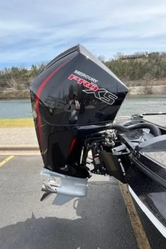 Slide: The Image of 2025 Nitro Z20 XL boat with Mercury Pro XS outboard motor by a river. - 8