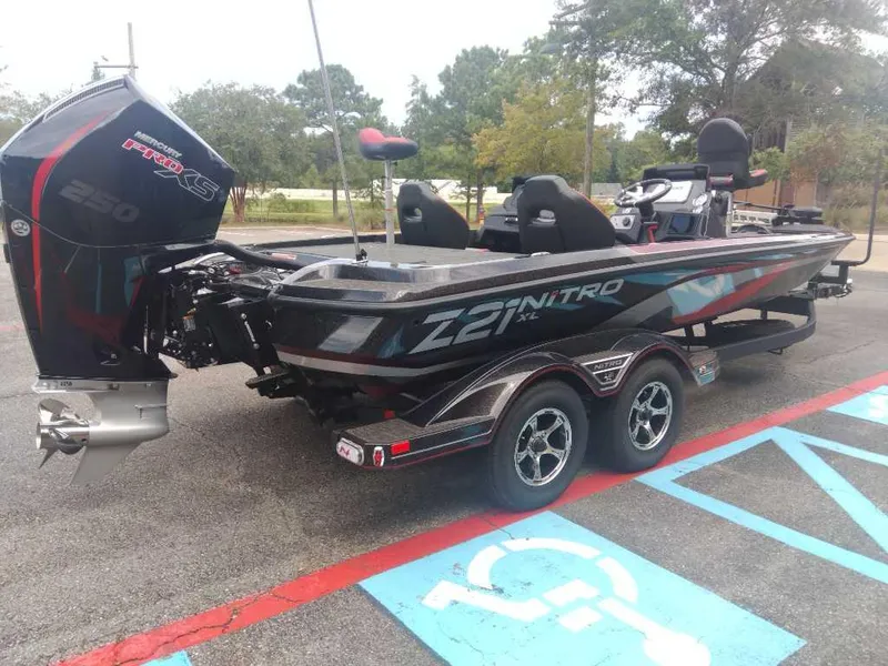 Slide: The Image of 2025 Nitro Z21 XL boat with powerful engine, parked in a lot. - 4