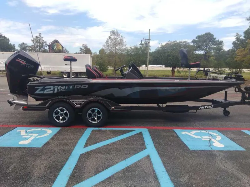 Slide: The Image of 2025 Nitro Z21 XL boat on trailer in parking lot. - 5