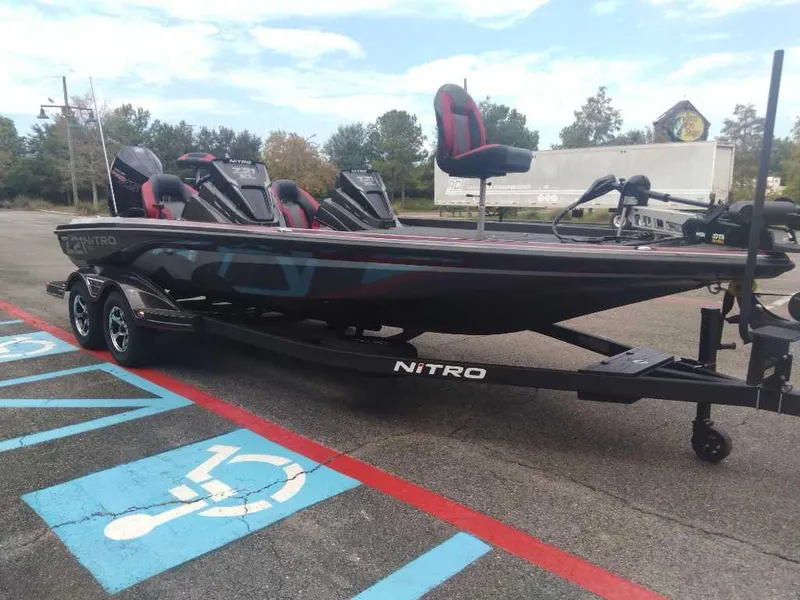 Slide: The Image of 2025 Nitro Z21 XL boat on trailer in parking lot. - 6