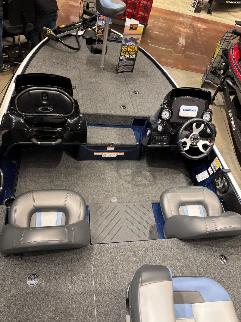 Slide: The Image of 2025 Nitro Z17 boat interior with steering wheel and seating, displayed indoors. - 4