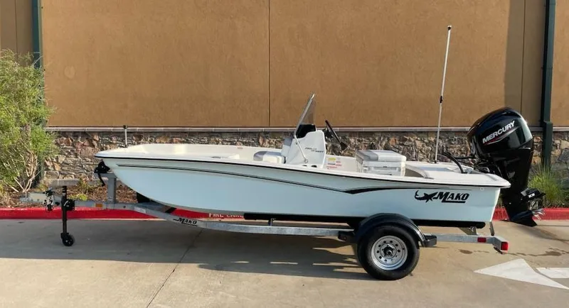 Slide: The Image of 2025 Mako Pro Skiff 15 CC boat on trailer, side view. - 0