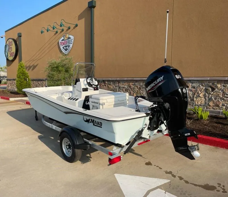 Slide: The Image of 2025 Mako Pro Skiff 15 CC boat with Mercury engine on trailer. - 7