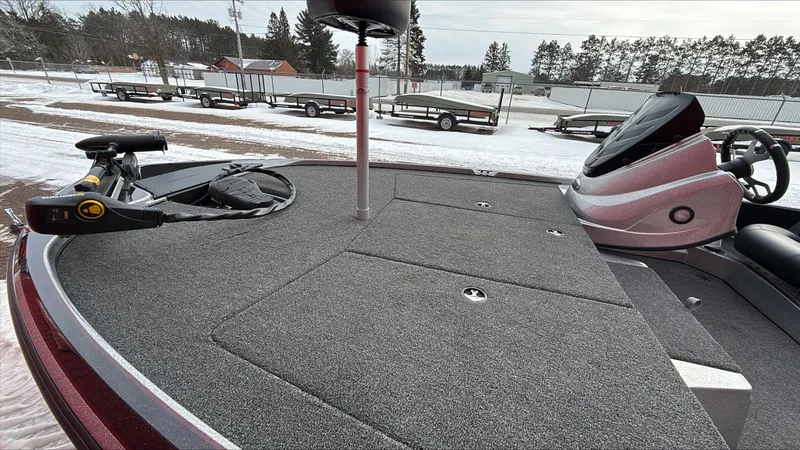 Slide: The Image of 2025 Nitro Z17 boat deck with fishing equipment, parked on snowy ground. - 3