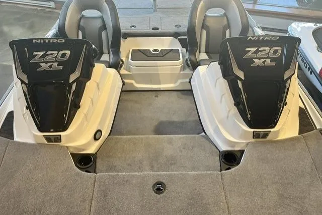Slide: The Image of 2025 Nitro Z20 XL boat interior with dual seats and carpeted deck. - 1