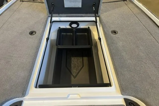 Slide: The Image of 2025 Nitro Z20 XL boat storage compartment with open lid and tray. - 8