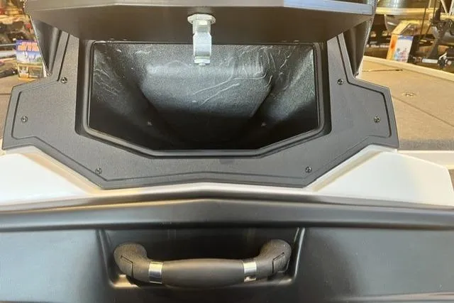 Slide: The Image of 2025 Nitro Z20 XL boat compartment with handle, showcasing storage space. - 9